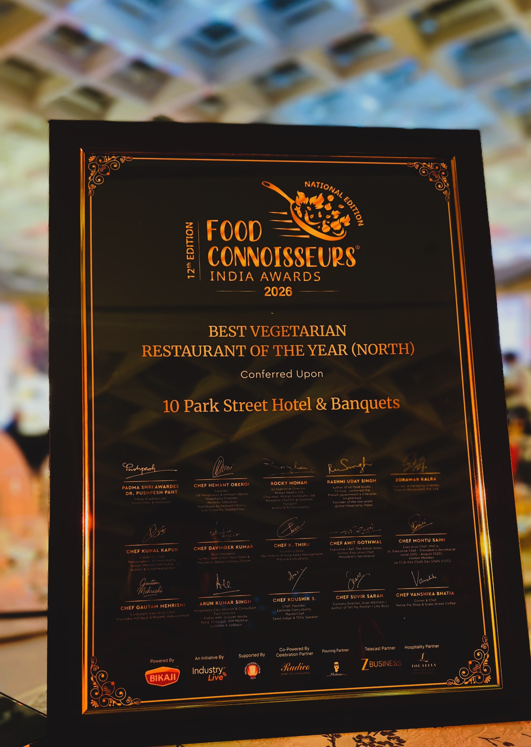 Framed certificate recognising 10 Park Street Hotel & Banquets as Best Vegetarian Restaurant of the Year (North) in 2026